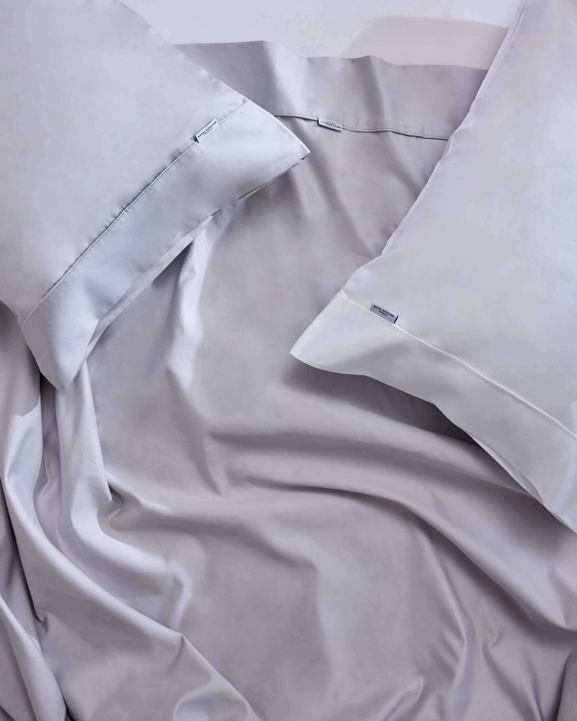 Royal Doulton Aria sheet set styled on a bed