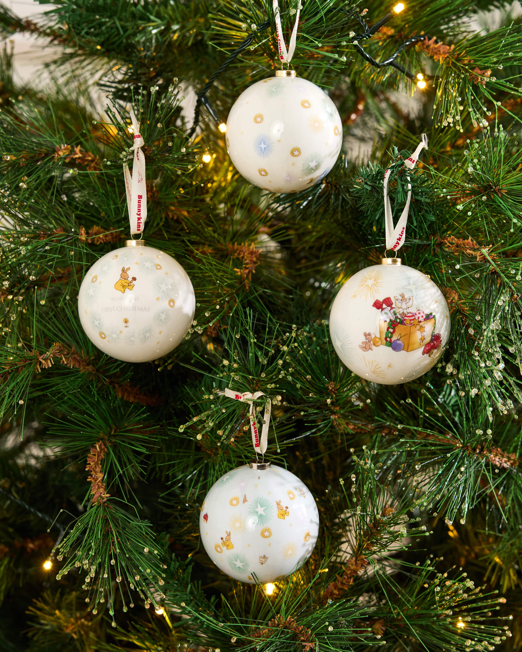 Royal Doulton Bunnykins Christmas baubles styled on a festive tree