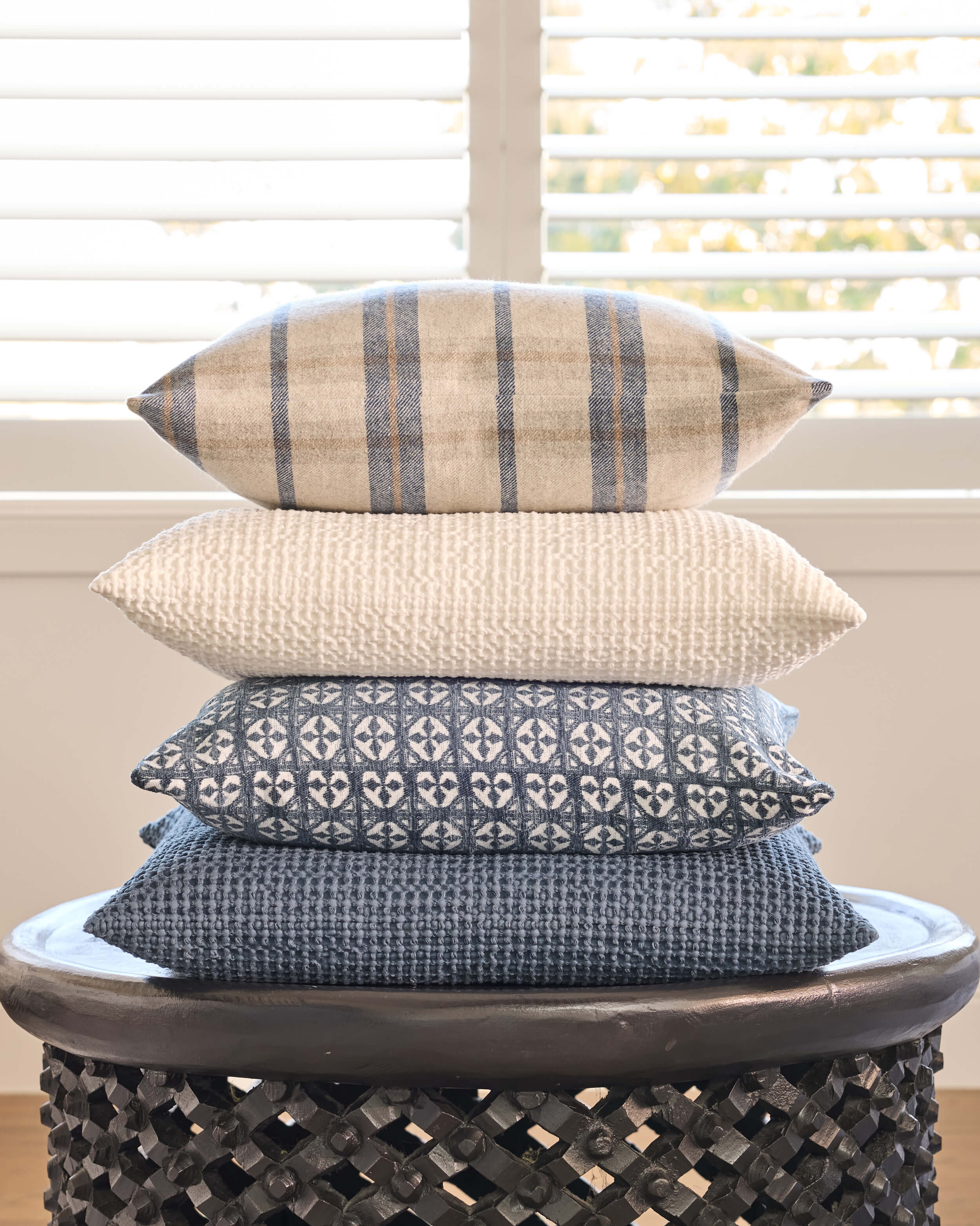 Royal Doulton blue cushions styled in a living room