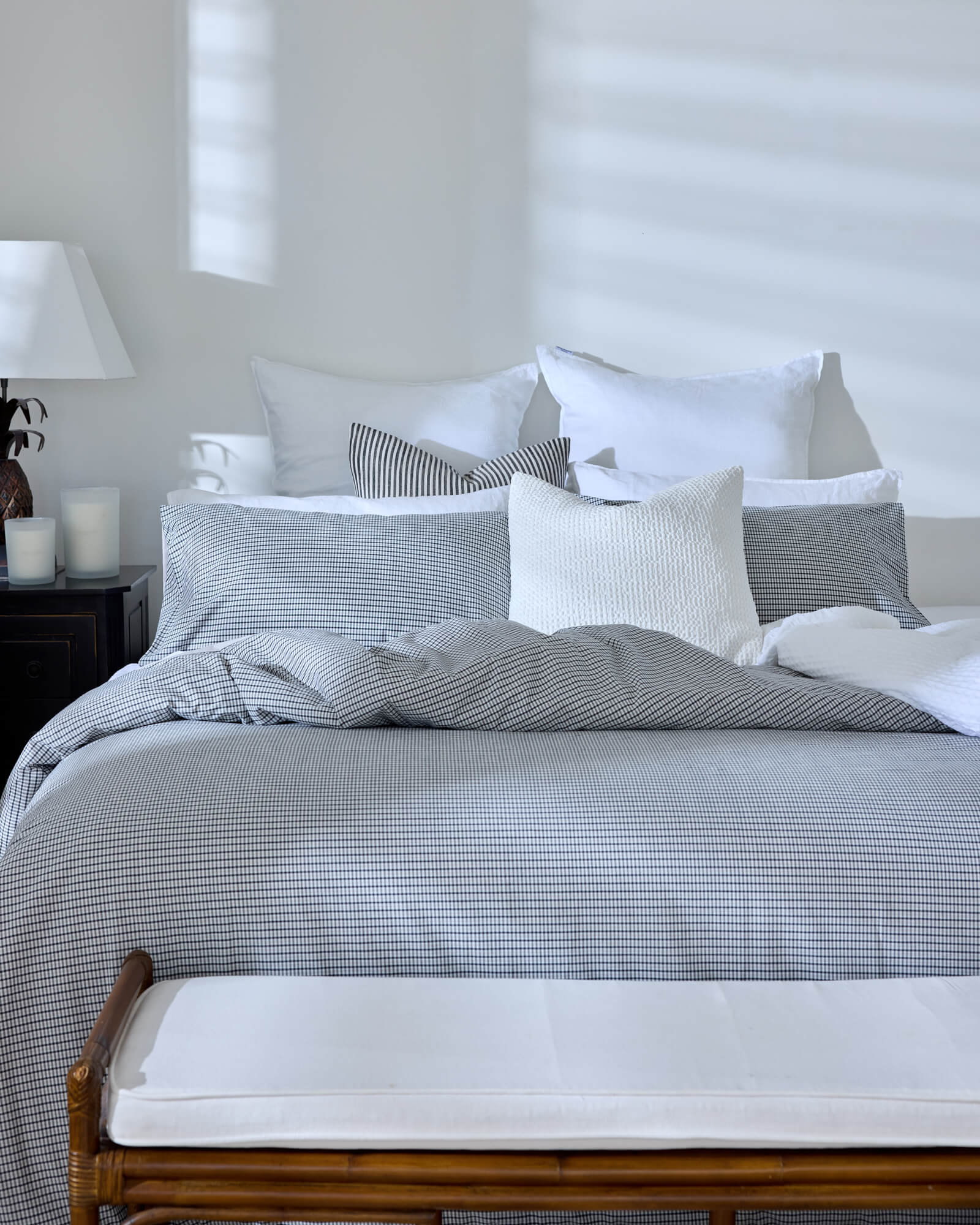 Royal Doulton Kent duvet cover styled on a bed with coordinating Wade duvet cover set, Winslow Snow Cushion​, Montrose Stripe Cushion​, Beaumont Check Cushion​.