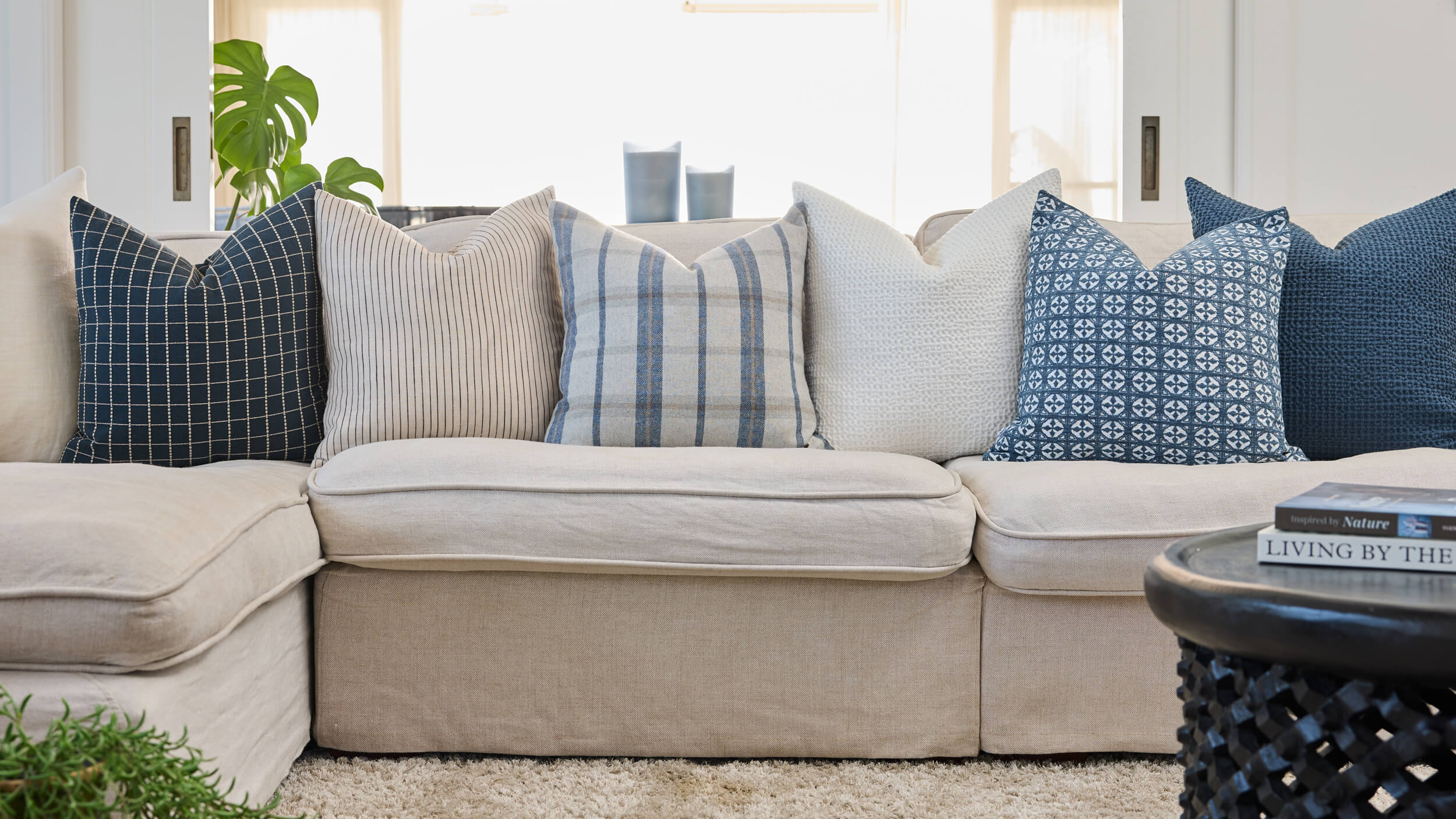 Royal Doulton blue cushions styled in a living room