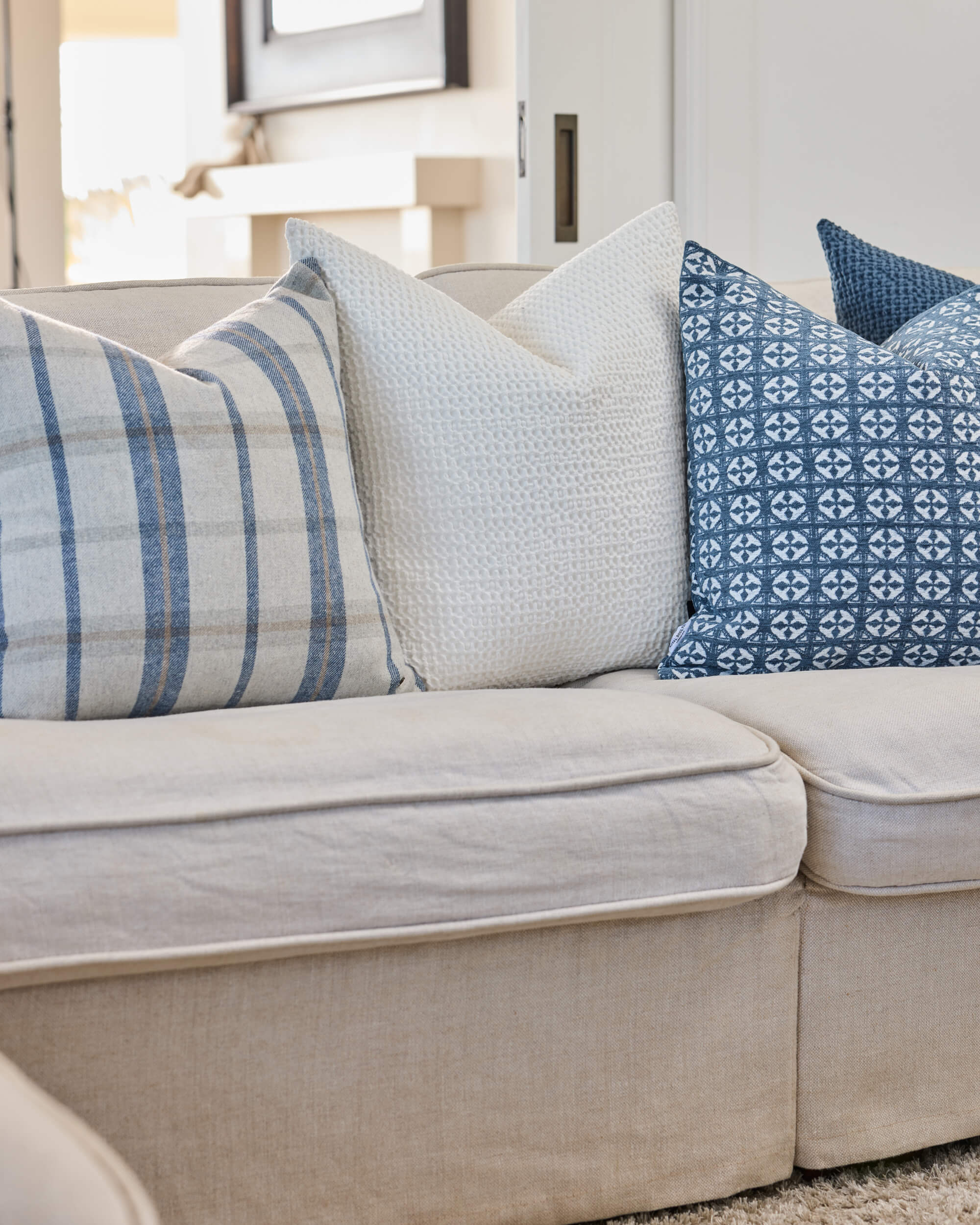 Royal Doulton blue cushions styled in a living room