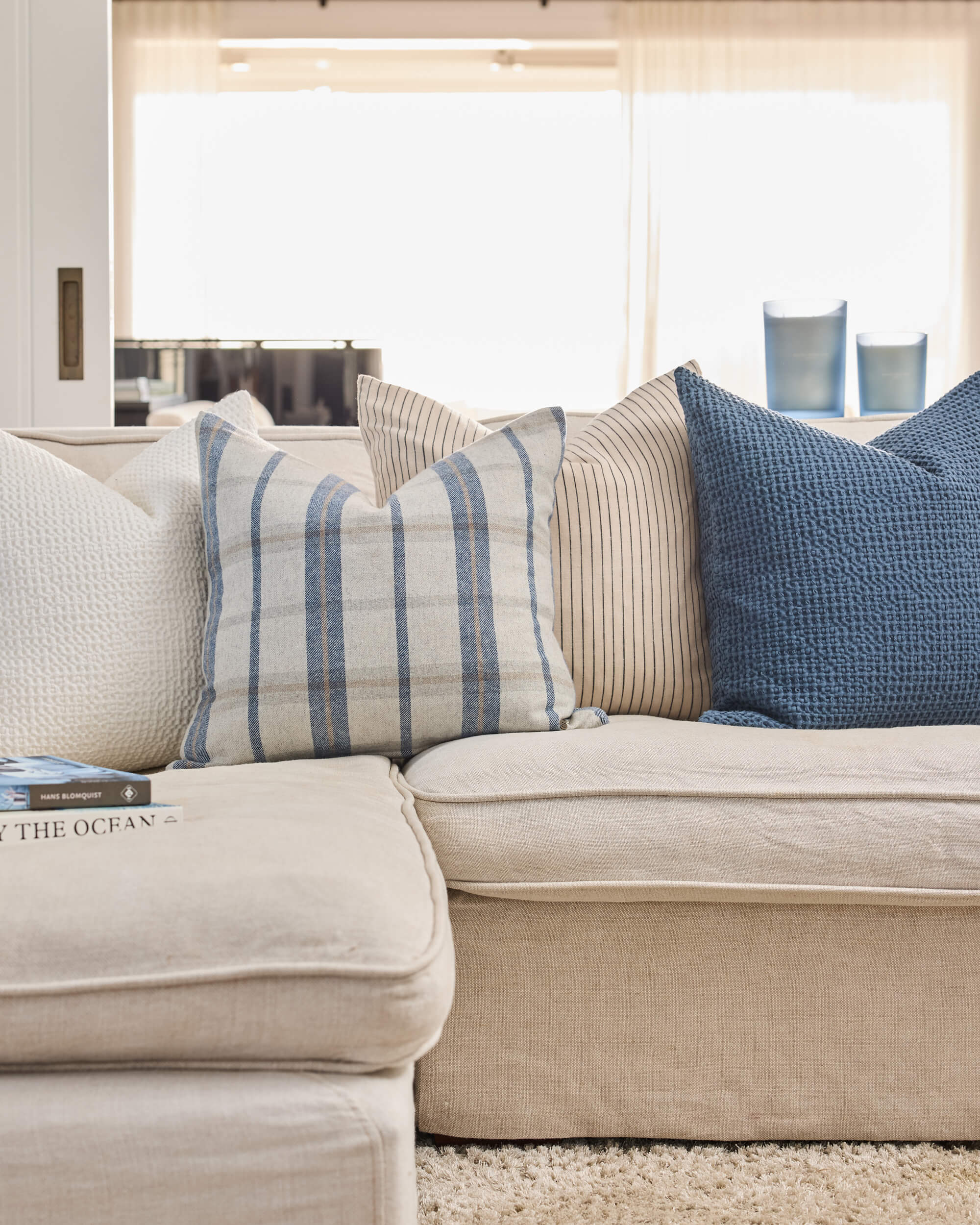 Royal Doulton blue cushions styled in a living room