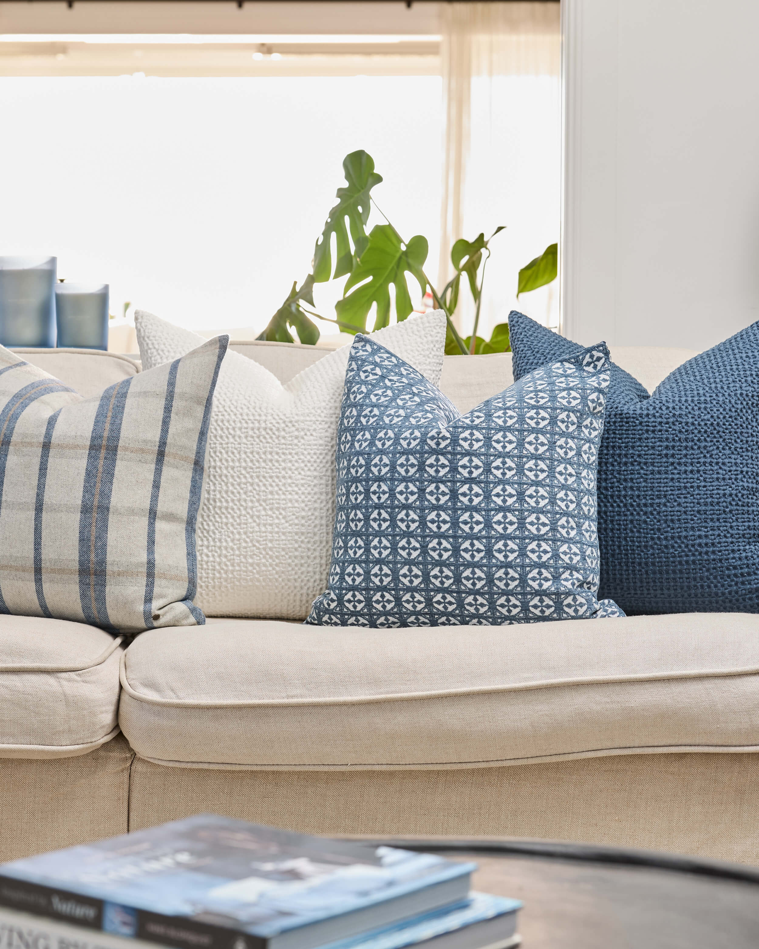 Royal Doulton blue cushions styled in a living room