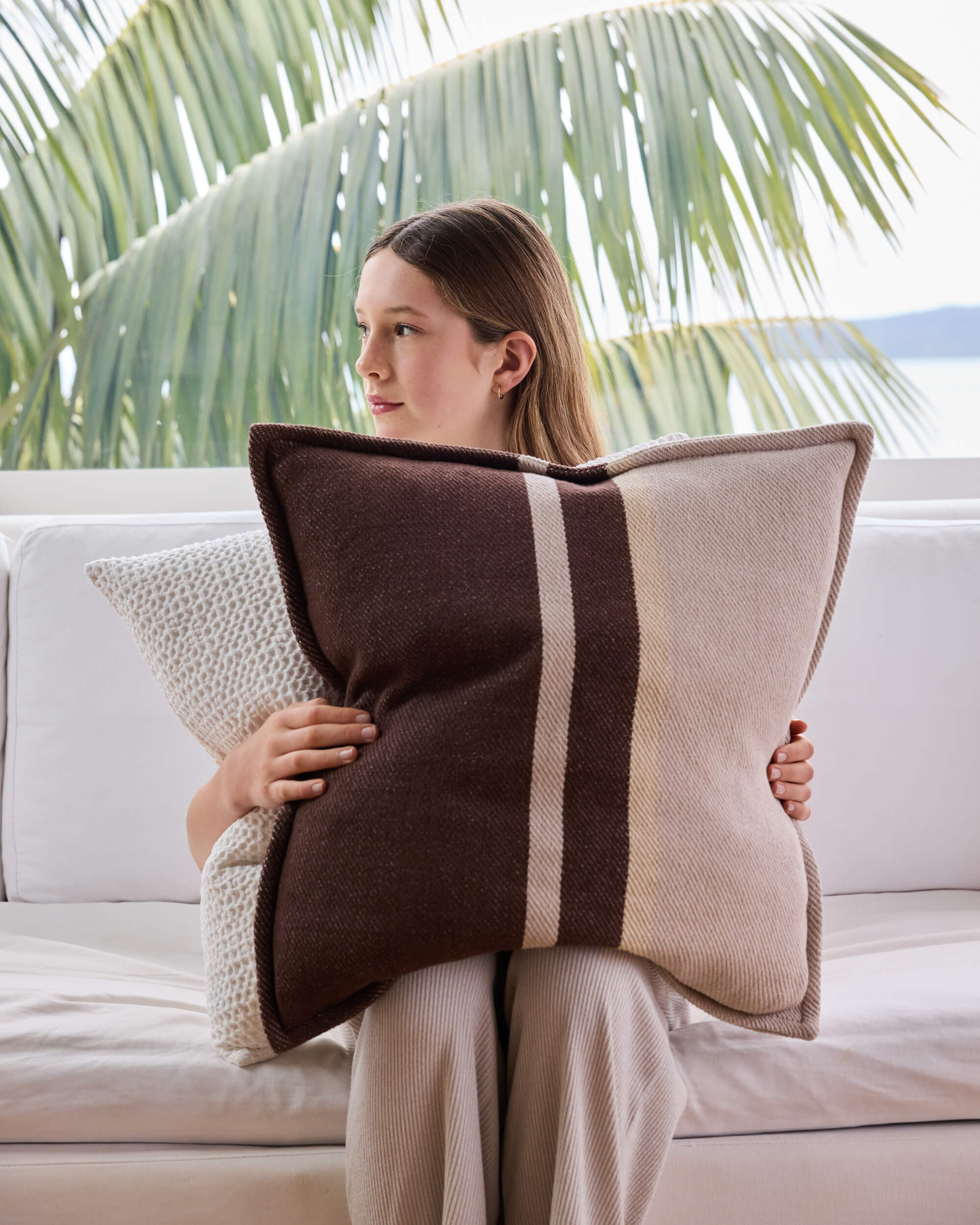 Royal Doulton brown cushions styled in a living room